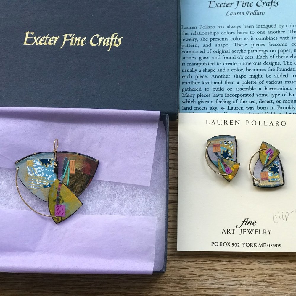 New set of pin and earrings by artist Lauren Pollaro. Wooden mixed metal paper.